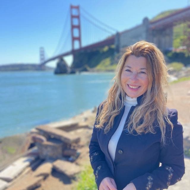 [Agent Name], Bay Area Real Estate Advisor, at the Golden Gate Bridge, San Francisco